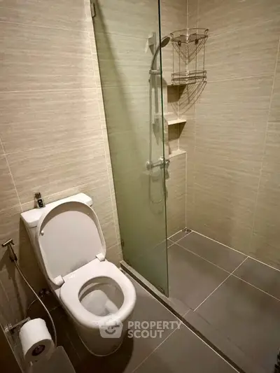 Modern bathroom with glass shower and sleek tile design