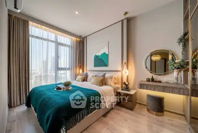 Luxurious bedroom with modern decor, large window, and elegant furnishings in a high-rise apartment.