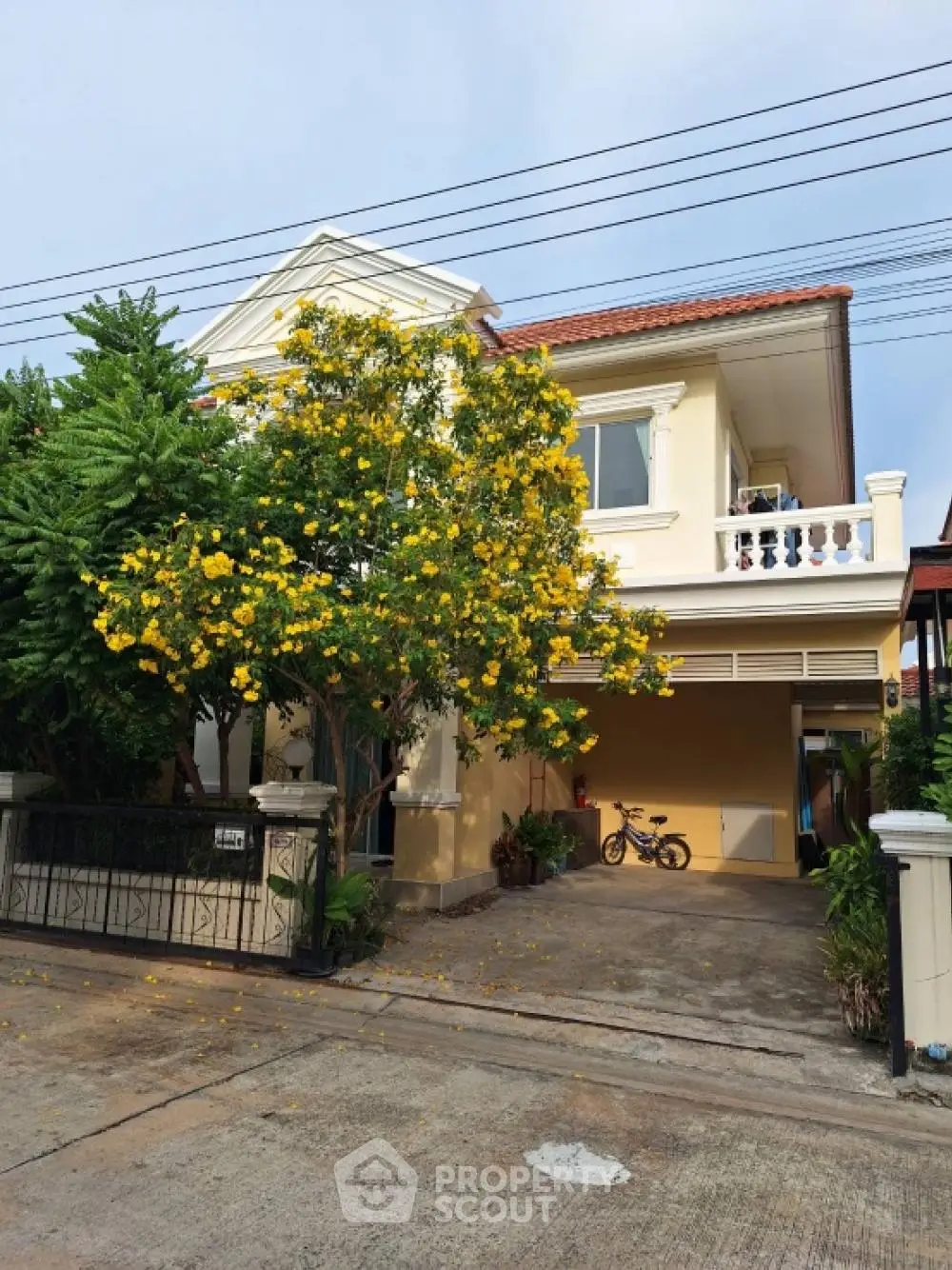 Charming two-story house with lush garden and spacious driveway