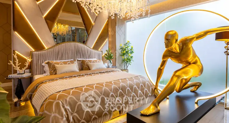 Luxurious bedroom with modern decor and unique golden sculpture, featuring elegant lighting and stylish bedding.