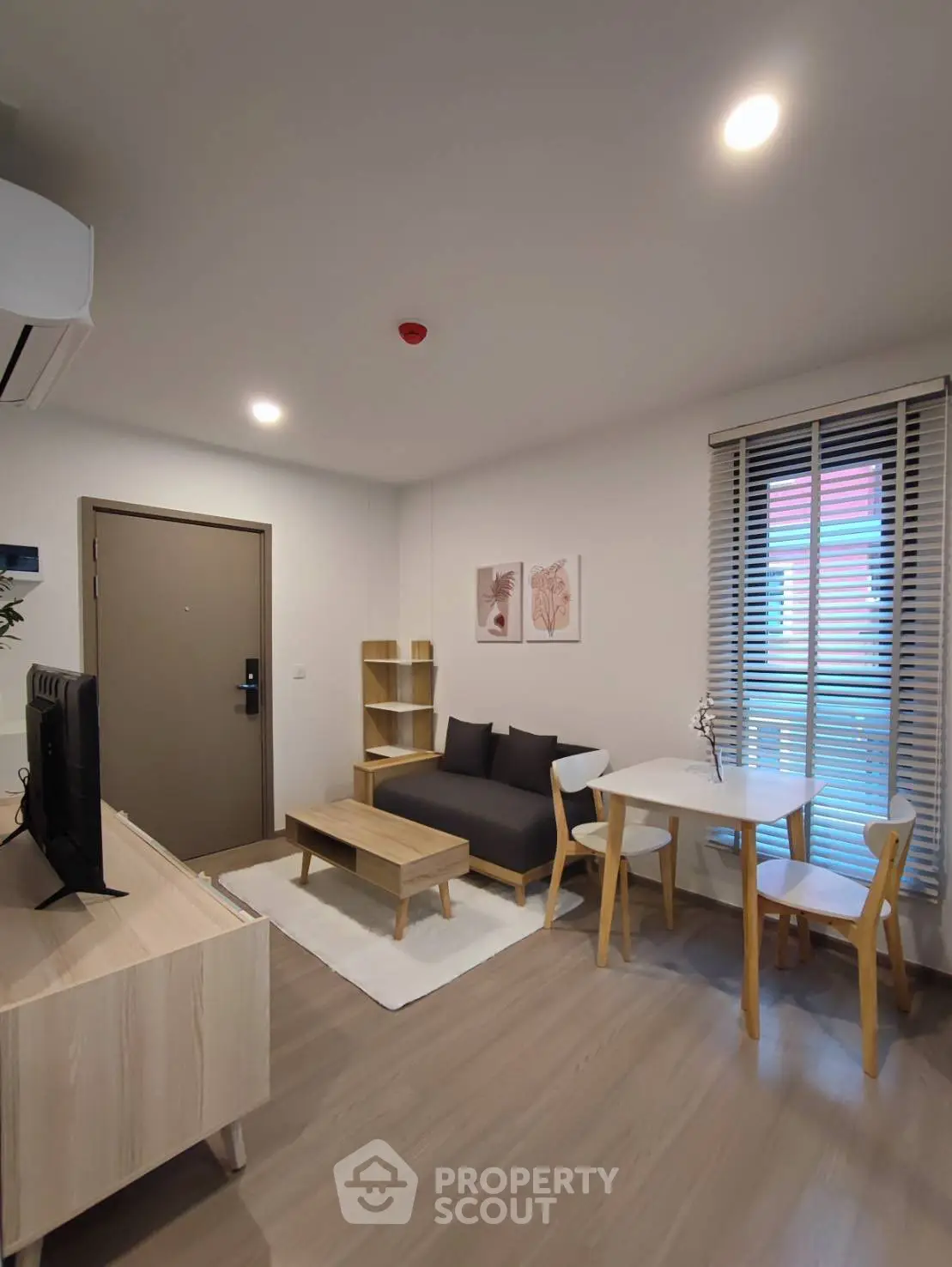 Modern living room with stylish furniture and natural light, perfect for cozy living.