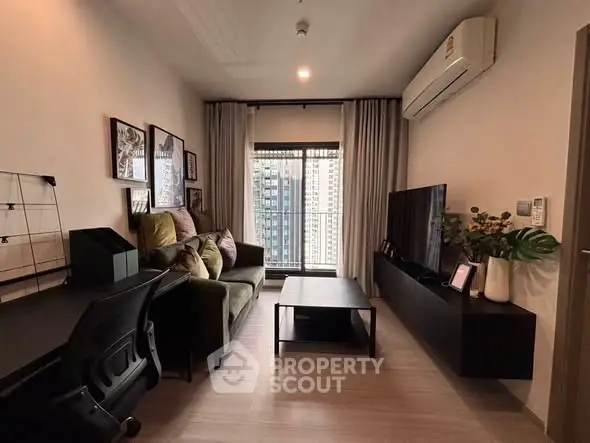 Modern living room with stylish decor and city view, featuring a comfortable sofa and sleek entertainment unit.