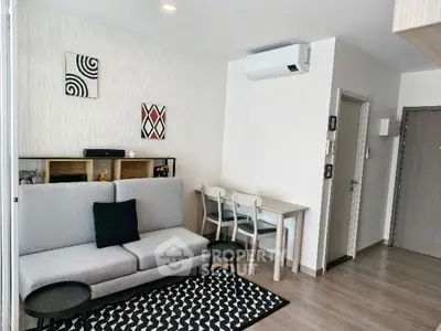 Modern living room with stylish decor and air conditioning in a cozy apartment.