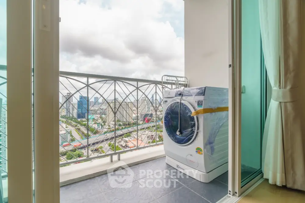 Modern balcony with city view and washing machine, perfect for urban living.