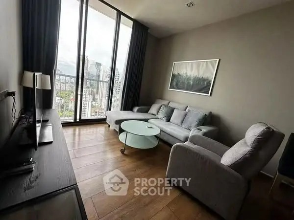 Modern living room with panoramic city view and stylish furniture