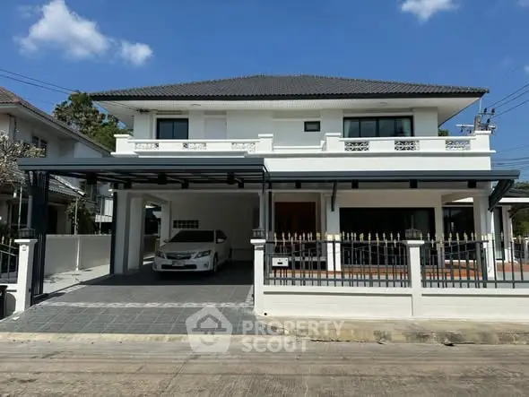 Stunning two-story house with modern design and spacious driveway in a serene neighborhood.