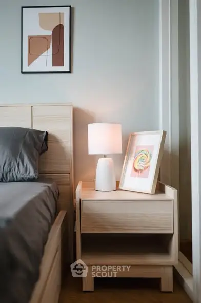 Modern bedroom with stylish decor and cozy lighting