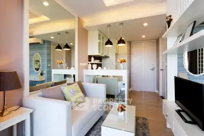 Modern living room with stylish decor and open layout, featuring cozy seating and elegant lighting.