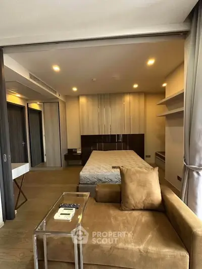 Modern studio apartment with cozy living area and stylish decor