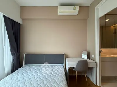 Cozy bedroom with modern furniture and air conditioning