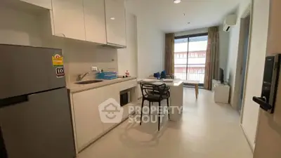 Modern compact kitchen with dining area in a cozy apartment