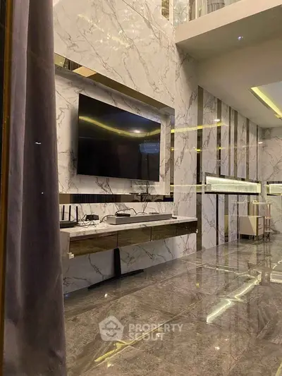 Luxurious modern living room with marble walls and large TV