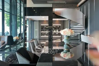 Luxurious modern living room with elegant spiral staircase and chic decor
