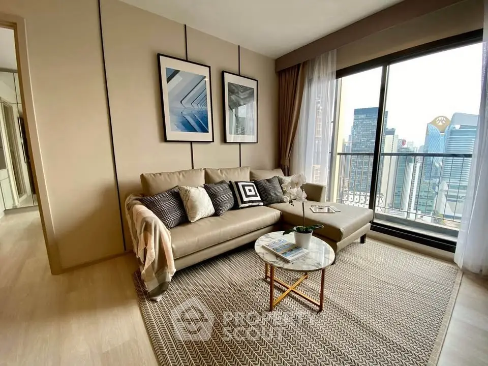 Stylish living room with modern decor and city view balcony in luxury apartment.