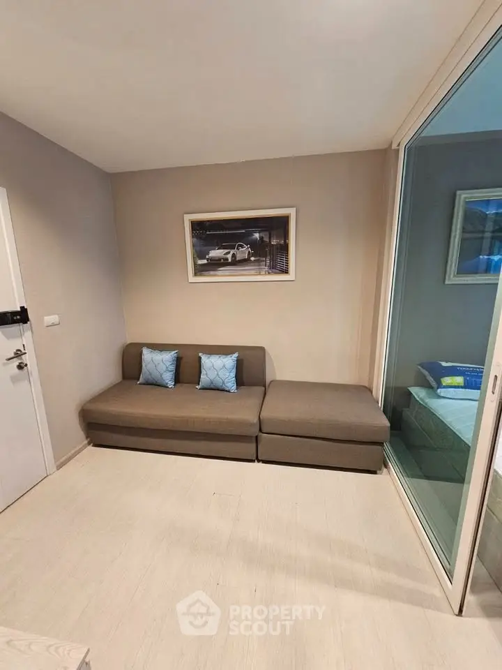 Cozy living room with modern sofa and stylish decor in a contemporary apartment.