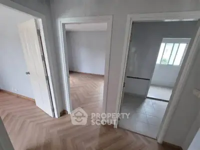 Spacious apartment interior with modern flooring and natural light