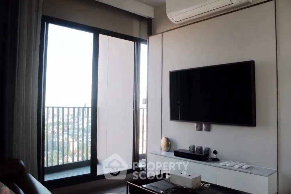 Modern living room with balcony view and wall-mounted TV