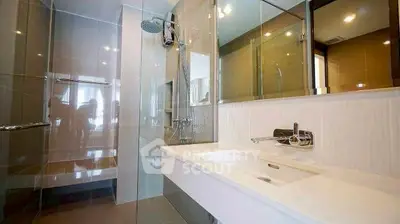 Modern bathroom with glass shower and sleek fixtures