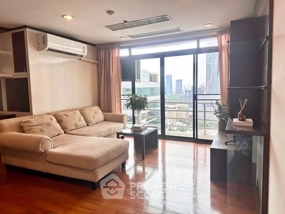 Spacious living room with city view and modern furnishings