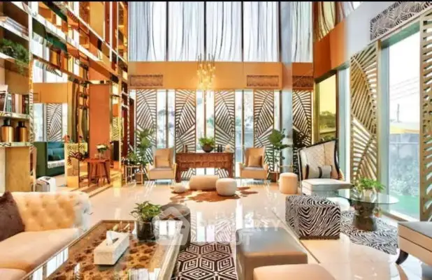 Luxurious living room with high ceilings, elegant decor, and abundant natural light.