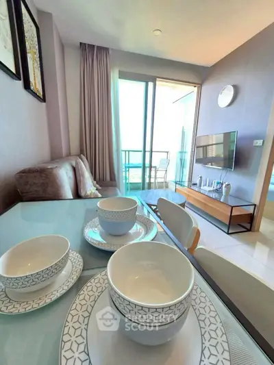 Modern living room with stylish decor and balcony view