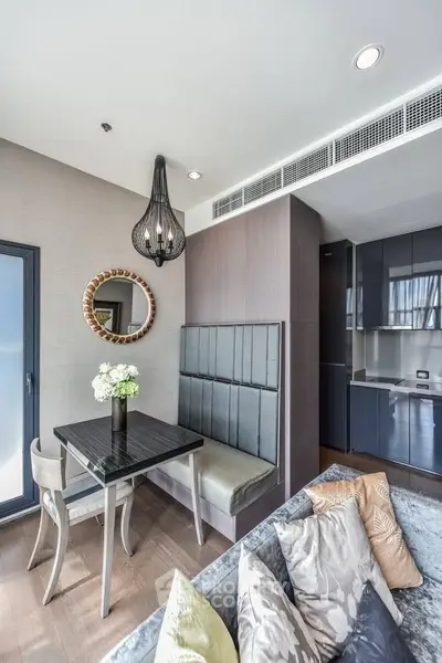Modern living room with stylish dining area and elegant decor in a contemporary apartment.