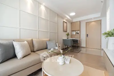 Modern living room with elegant decor and cozy seating area in a stylish apartment.