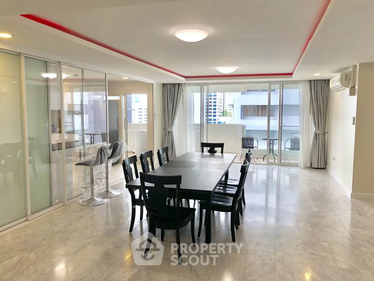 Spacious modern dining area with elegant marble flooring and large windows offering city views.