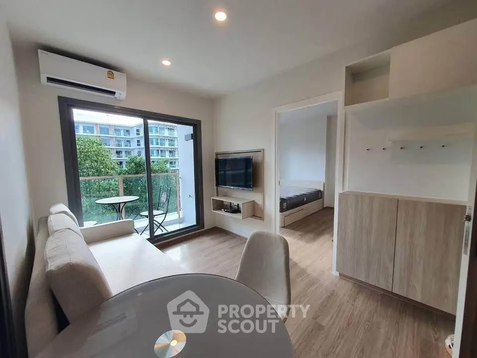 Modern living room with balcony view in stylish apartment