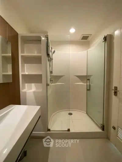 Modern bathroom with glass shower and sleek fixtures