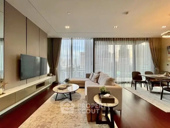 Luxurious modern living room with elegant decor and city view, featuring a spacious seating area and dining space.