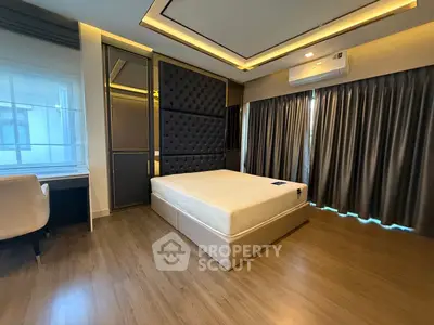 Luxurious modern bedroom with elegant design and ample natural light