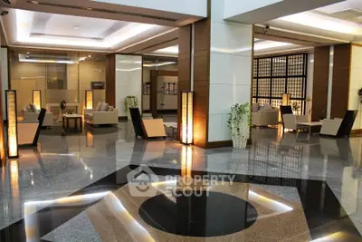 Luxurious modern building entrance with elegant seating and ambient lighting