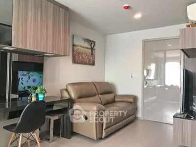 Modern living room with leather sofa and sleek decor in a stylish apartment.