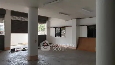 Spacious commercial space with open layout and large windows for natural light.