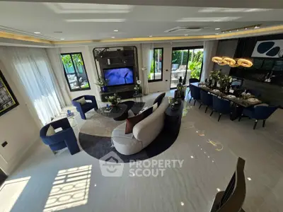 Luxurious modern living room with elegant dining area and garden view