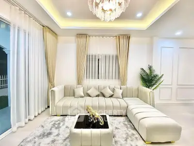 Luxurious living room with elegant chandelier and plush sectional sofa
