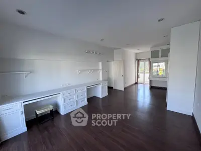 Spacious modern study room with elegant wooden flooring and ample natural light