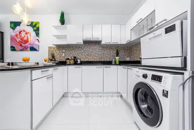 Modern white kitchen with washing machine and mosaic backsplash