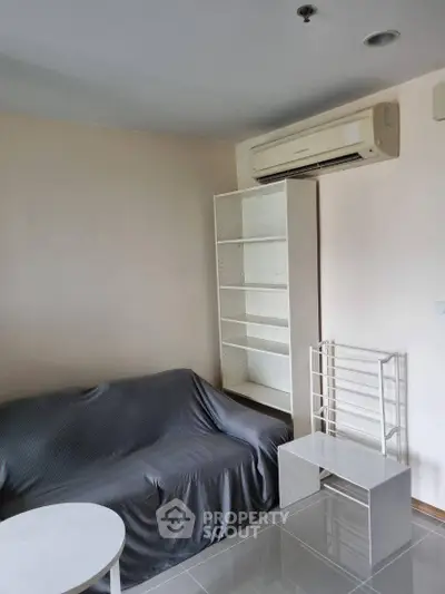 Cozy living room with air conditioning and modern furniture in a stylish apartment.