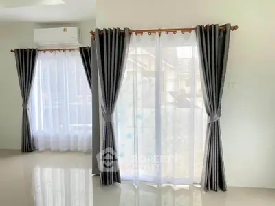 Bright living room with elegant curtains and natural light