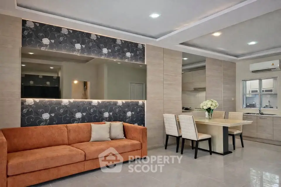 Modern living room with open kitchen and stylish decor