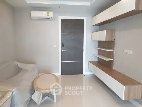 Modern living room with sleek furniture and air conditioning