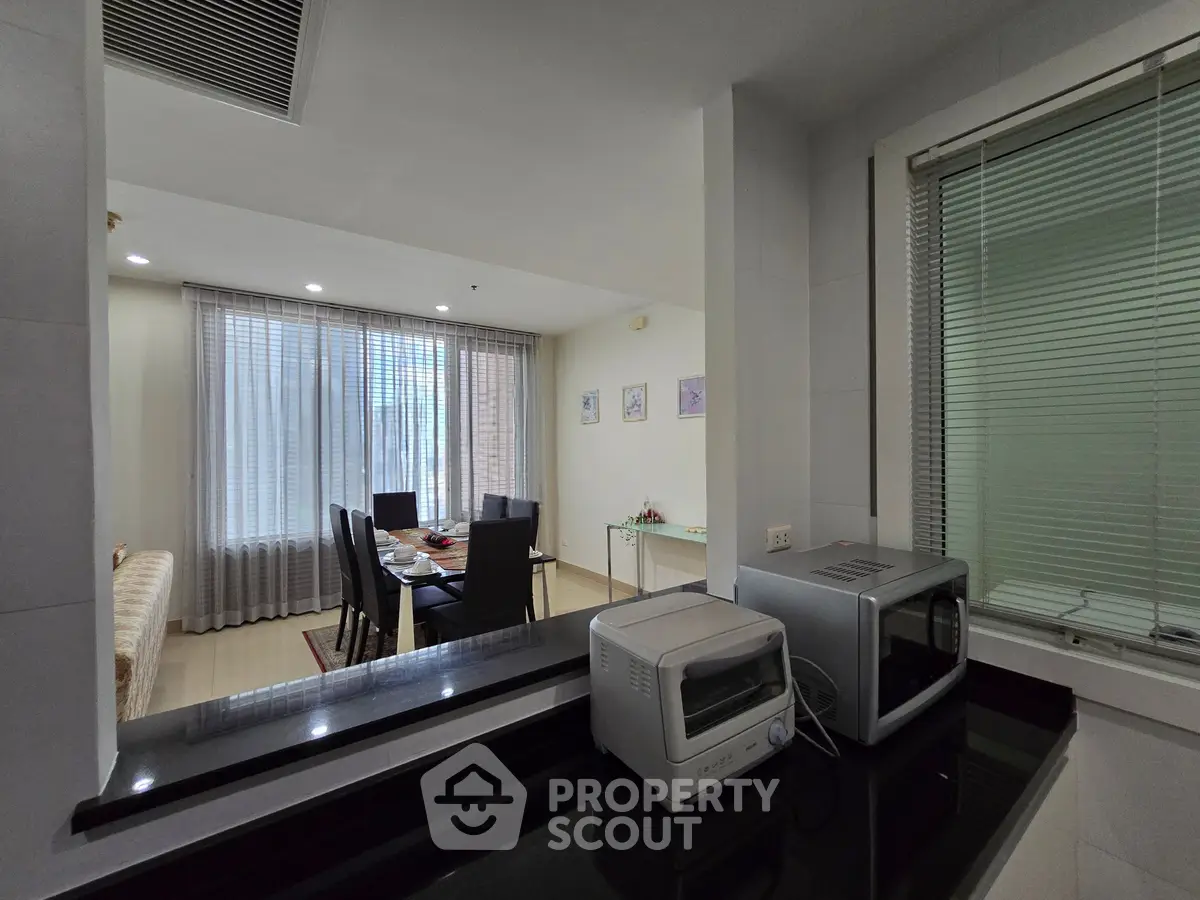 Spacious dining area with modern appliances and natural light