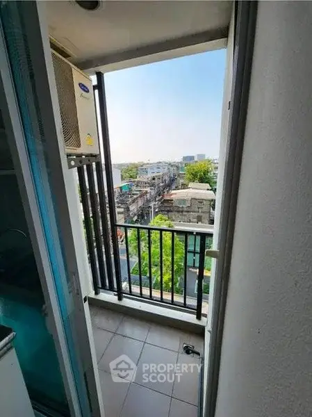 Charming balcony with city view, perfect for relaxation and enjoying the urban landscape.