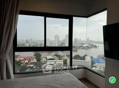 Stunning high-rise bedroom with panoramic city and river view