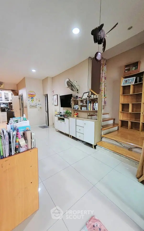 Spacious living room with modern decor and built-in shelving