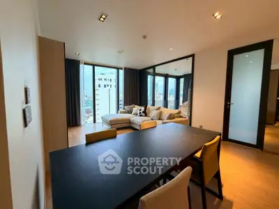 Spacious modern living room with city view and elegant dining area