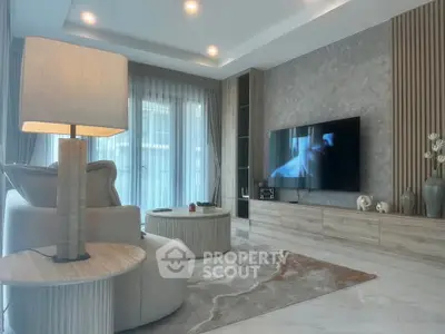 Luxurious modern living room with elegant decor and large TV