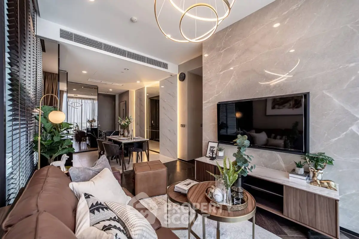 Luxurious modern living room with elegant decor and open layout, featuring stylish lighting and contemporary furniture.